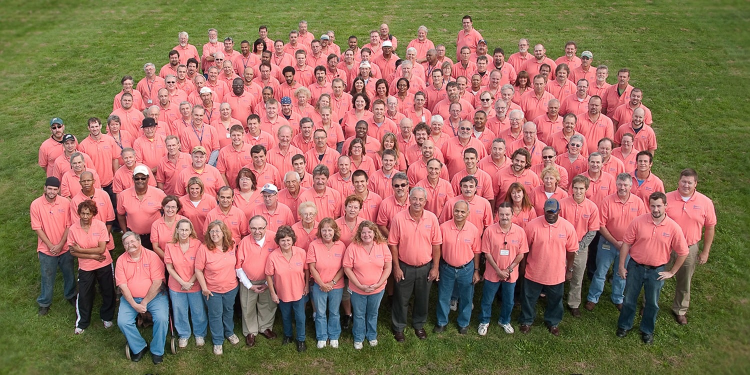 Cooperate photo of many employees shot from above 