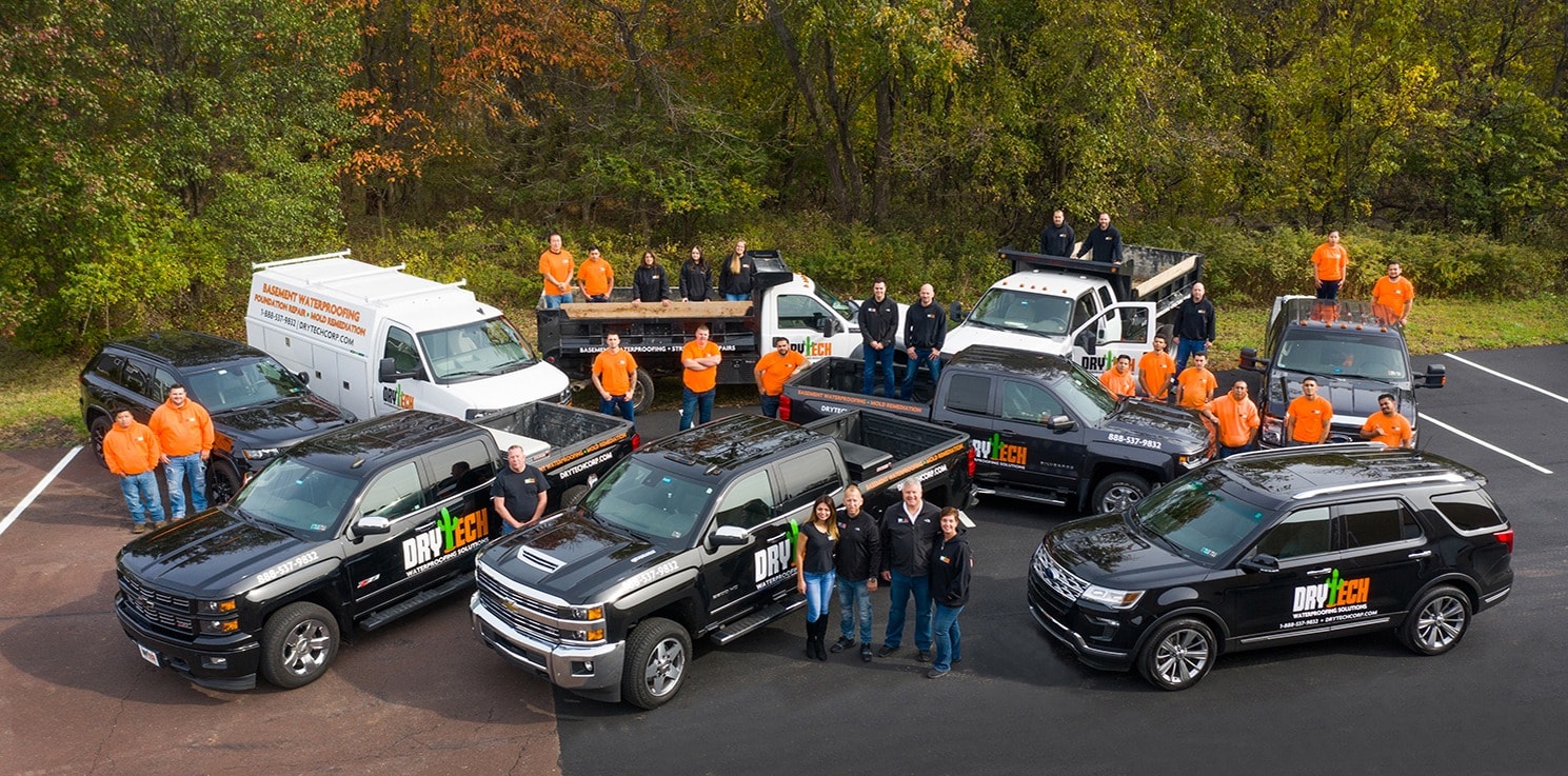 Company vehicles and employees photographed from drone