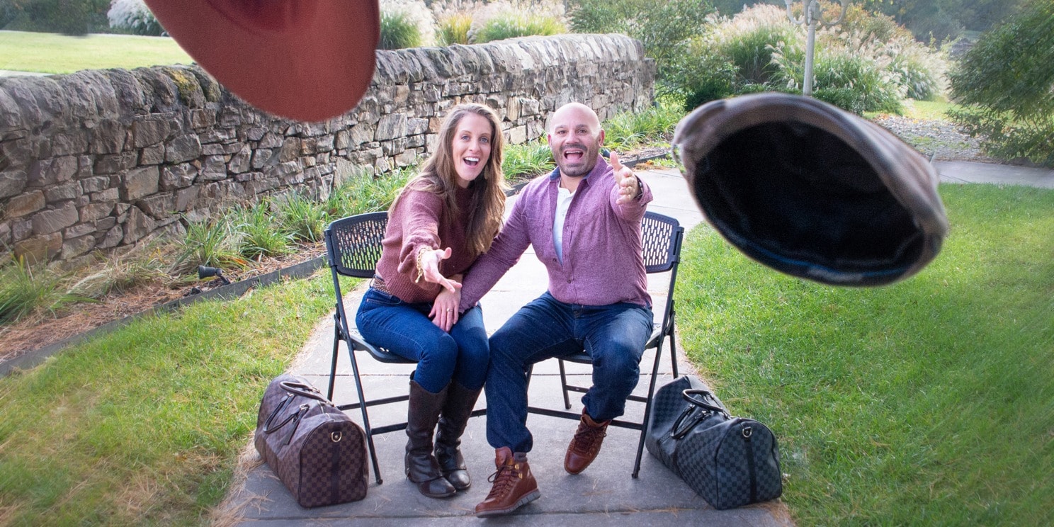 Young couple engagement photo in front of tractor